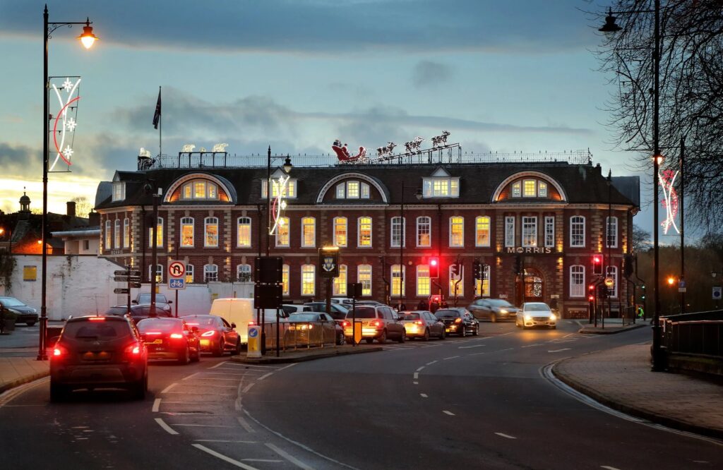 An evening view of Shrewsbury with Christmas lights and cars on the Smithfield Road